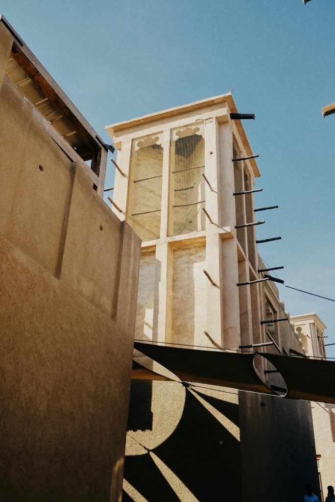 Low angle shot of historical wind tower architecture in Dubai, showcasing traditional construction techniques.